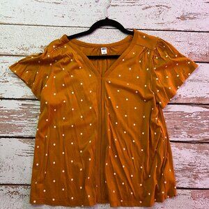 Gold tee with white polka dots